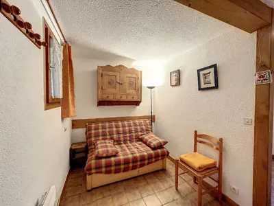 a living room with a couch and a chair at Studio cabine proche centre Combloux, 4 pers, balcon, parking - FR-1-560-53 in Combloux