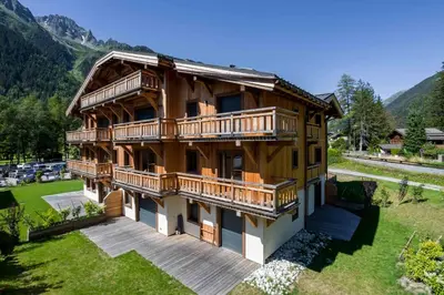 a large wooden house with a large yard at Coin des Drus Apartment - Chamonix All Year in Chamonix-Mont-Blanc