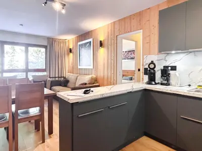 a kitchen and a living room with a counter top and a kitchen sidx sidx sidx at 2 Bed Ski in and Ski out Luxury Apt in 5 star Residence in Flaine