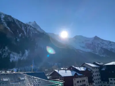 a view of a city with mountains in the background at Alta Rocca in Chamonix-Mont-Blanc