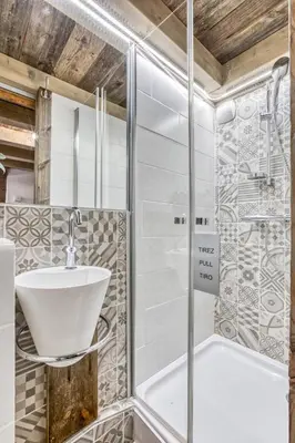 a bathroom with a sink and a shower at Alta Rocca in Chamonix-Mont-Blanc