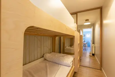 a small room with a bunk bed in it at Rare ! Appartement rénové dans le centre piéton de Megève in Megève