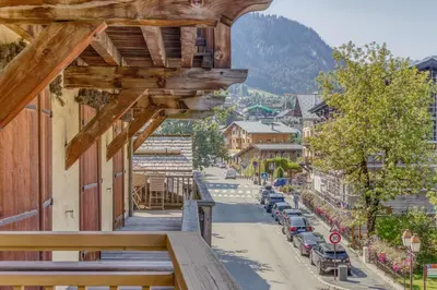 a view of a town from a balcony of a building at Rare ! Appartement rénové dans le centre piéton de Megève in Megève
