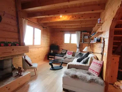a living room with a couch and chairs in a cabin at Chalet 3 chambres 8 pers avec cheminée et parking à 1000m des pistes - FR-1-572-49 in Les Carroz d'Araches