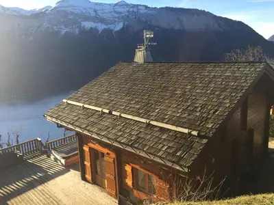 a roof of a house with a view of a mountain at Chalet 3 chambres 8 pers avec cheminée et parking à 1000m des pistes - FR-1-572-49 in Les Carroz d'Araches