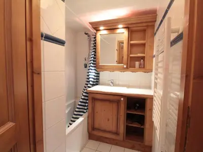 a bathroom with a sink and a shower at Appartement 3 Pièces 6 Pers avec Balcon aux Carroz - FR-1-572-53 in Les Carroz d'Araches