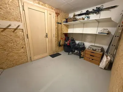 a room with a door and a chair in a room at Chalet équipé avec poêle et garage, proche centre et remontées mécaniques - FR-1-572-107 in Les Carroz d'Araches