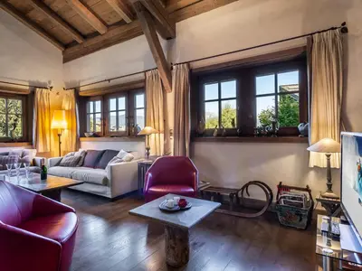 a living room with a couch and a table at Chalet familial à Megève avec piscine et sauna pour 12 personnes - FR-1-569-2 in Megève