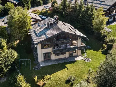 an aerial view of a house with a roof at Chalet familial à Megève avec piscine et sauna pour 12 personnes - FR-1-569-2 in Megève