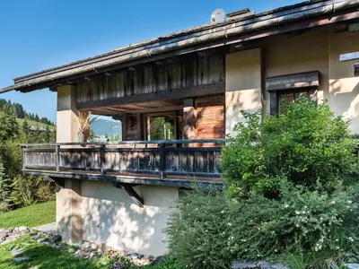 a house with a balcony on the side of it at Chalet familial à Megève avec piscine et sauna pour 12 personnes - FR-1-569-2 in Megève