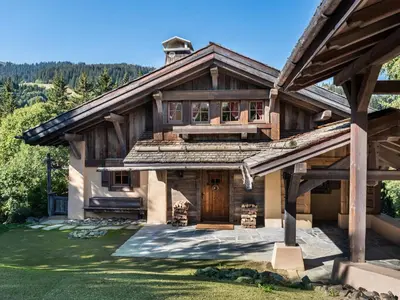 a large wooden house with a gambrel roof at Chalet familial à Megève avec piscine et sauna pour 12 personnes - FR-1-569-2 in Megève