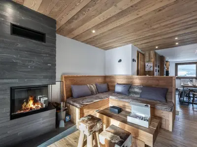 a living room with a couch and a fireplace at Charmant appartement au Mont d'Arbois proche pistes, parking inclus - FR-1-569-11 in Megève