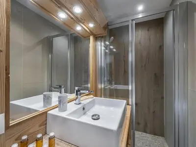 a bathroom with a white sink and a shower at Charmant appartement au Mont d'Arbois proche pistes, parking inclus - FR-1-569-11 in Megève