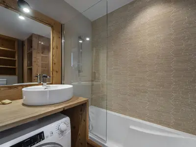 a bathroom with a sink and a glass shower at Charmant appartement au Mont d'Arbois proche pistes, parking inclus - FR-1-569-11 in Megève