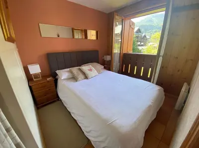 a small bathroom with a toilet and a sink at Jardin des Neiges - 11A in Samoëns