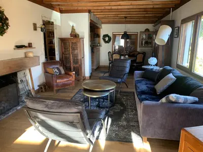 a living room with a couch and a table at Le Solli in Saint-Gervais-les-Bains
