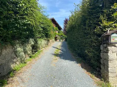 a gravel road with bushes on either side of it at Le Solli in Saint-Gervais-les-Bains