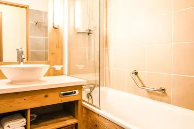 a bathroom with a sink and a shower and a tub at Les Terrasses d'Eos, 1-bed apartment with fireplace, Ski in, Ski out in Flaine
