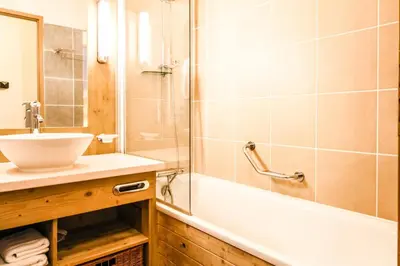 a bathroom with a sink and a shower and a tub at Les Terrasses d'Eos, 1-bed apartment with fireplace, Ski in, Ski out in Flaine