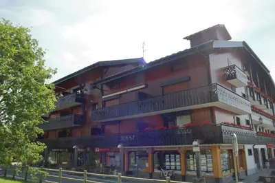 a large building with balconies on the side of it at CA116 Studio 4 Pers centre des Carroz in Les Carroz d'Araches