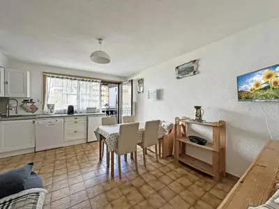a kitchen and dining room with a table and chairs at CA116 Studio 4 Pers centre des Carroz in Les Carroz d'Araches