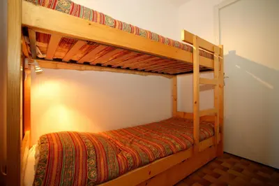 a bedroom with two bunk beds in a room at PE255 Studio 4 pers pieds de piste in Les Carroz d'Araches