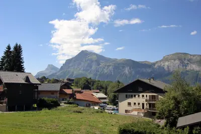 a village with a mountain in the background at PE255 Studio 4 pers pieds de piste in Les Carroz d'Araches