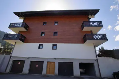 a large brick building with balconies on it at PE255 Studio 4 pers pieds de piste in Les Carroz d'Araches
