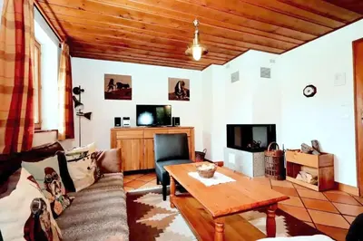 a living room with a couch and a table at Chalet Ulysse - Chalet Ulysse MAE-6403 in Les Houches