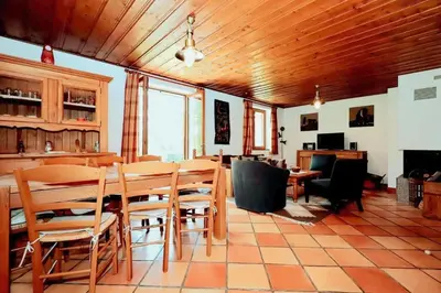 a dining room with a table and chairs at Chalet Ulysse - Chalet Ulysse MAE-6403 in Les Houches