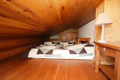 a bedroom with a bed in a wooden ceiling at Résidence Les Hauts De Chavants - Hauts de Chavants Albert 1er 13 MAE-6404 in Les Houches