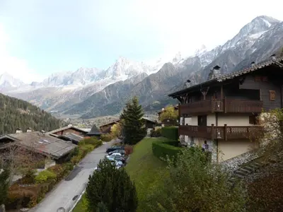 a view of a village with mountains in the background at Résidence Les Hauts De Chavants - Hauts de Chavants Albert 1er 13 MAE-6404 in Les Houches