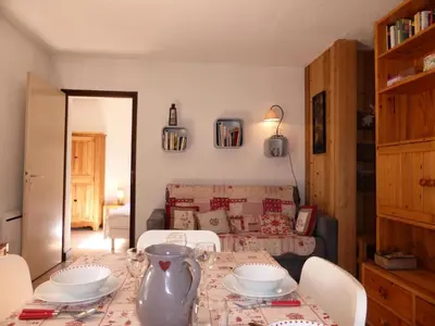 a living room with a table with a vase on it at Résidence Aiguille Du Midi Bat A - Aiguille du Midi A778 MAE-6406 in Les Houches