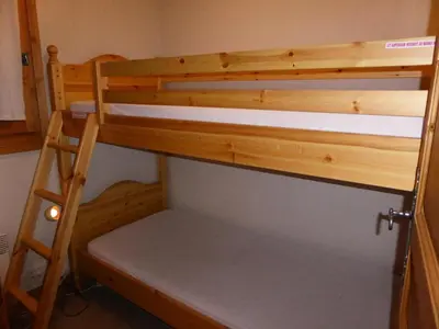 a bunk bed in a room with a ladder at Résidence Les Amethystes B - Améthystes B02 MAE-6409 in Les Houches