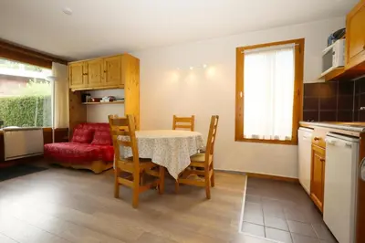 a kitchen and dining room with a table and chairs at Résidence Le Prarion 2 C - Prarion 2 Bât A MAE-6413 in Les Houches