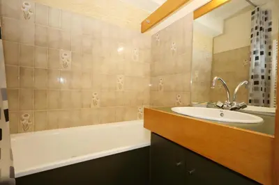 a bathroom with a sink and a bath tub at Résidence Le Prarion 2 C - Prarion 2 Bât A MAE-6413 in Les Houches