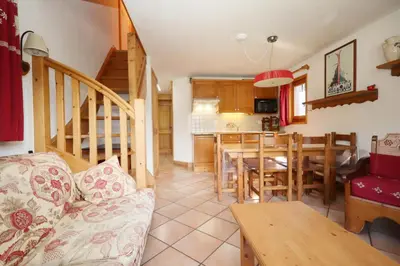 a living room with a couch and a dining room at Résidence Les Hauts De Chavants - Hauts de Chavants Vallot 3 MAE-6414 in Les Houches