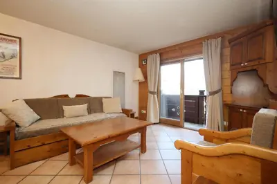 a living room with a couch and a table at Résidence Les Hauts De Chavants - Hauts de Chavants Berard 10 MAE-6415 in Les Houches