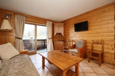 a living room with a couch and a table at Résidence Les Hauts De Chavants - Hauts de Chavants Berard 10 MAE-6415 in Les Houches