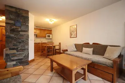 a living room with a couch and a table at Résidence Les Hauts De Chavants - Hauts de Chavants Berard 10 MAE-6415 in Les Houches