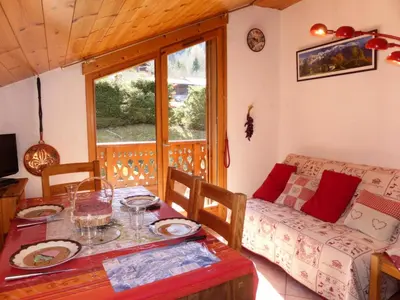 a living room with a table and a couch at Chalets Alpages - Chalets Alpages 4 MAE-6417 in Les Houches