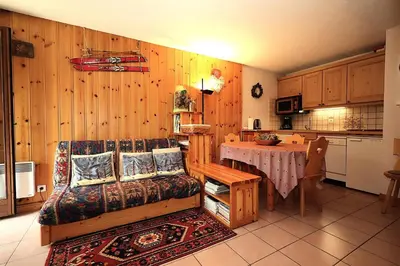 a living room with a couch and a table at Résidence Les Aiguilles Rouges Bat B - Aiguilles Rouges B6 MAE-6418 in Les Houches