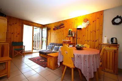 a living room with a table and a couch at Résidence Les Aiguilles Rouges Bat B - Aiguilles Rouges B6 MAE-6418 in Les Houches