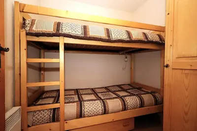 a couple of bunk beds in a room at Résidence Les Aiguilles Rouges Bat B - Aiguilles Rouges B6 MAE-6418 in Les Houches