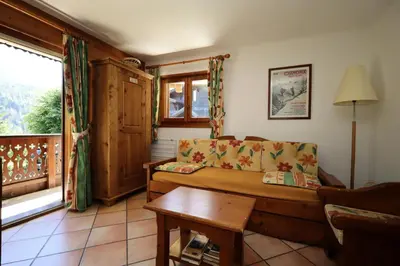 a living room with a couch and a table at Résidence Les Hauts De Chavants - Hauts de Chavants Berard 01 MAE-6419 in Les Houches