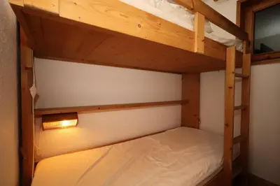 a bedroom with two bunk beds in a room at Résidence Les Hauts De Chavants - Hauts de Chavants Berard 01 MAE-6419 in Les Houches
