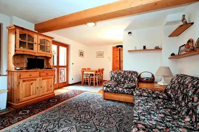 a living room with a couch and a tv at Résidence Beauregard - Beauregard 6 MAE-6421 in Les Houches