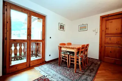 a dining room with a table and chairs and a window at Résidence Beauregard - Beauregard 6 MAE-6421 in Les Houches