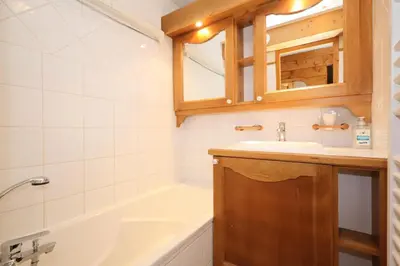 a bathroom with a tub and a sink and a bath tub at Résidence Les Hauts De Chavants - Hauts de Chavants Berard 04 MAE-6426 in Les Houches