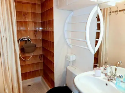 a bathroom with a sink and a toilet and a mirror at Résidence Le Prarion 2 C - Prarion 2 28 MAE-6429 in Les Houches